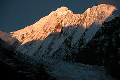 Annapurna 13 04 Gangapurna Sunrise From Manang Gangapurna (7455m) shone in the morning sun from Manang. Gangapurna was first climbed on May 6, 1965 via the East Ridge by a Gunter Hauser, Ludwig Greissl, Hermann Kollensperger, Erich Reismueller, Ang Temba Sherpa, and Phu Dorje Sherpa.